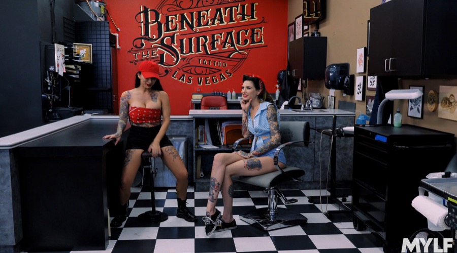 Brunettes share cock at tattoo shop - XXX Dessert - Picture 1