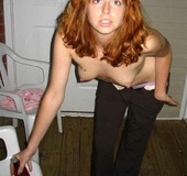 Bdsm girls. Red Head enslaved and bound.
