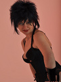 Spikey haired mistress posing with her - Picture 9