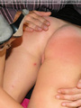 Pretty teen spanked OTK on her spreaded - Picture 4