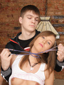 Lovely leashed young slave babe receives - Picture 1