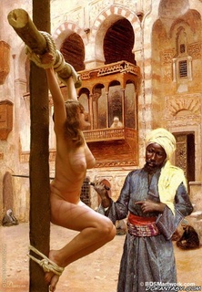 Submission art. Sheila found herself naked and srpead-eagled in the full view of a long line of men!