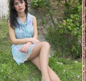 Stunning babe in short dress exposing her lovlely feet outdoors.