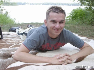 Smily young twink stripteasing and wanking on the river bank. Tags: Outdoor masturbation, gay pics, nude men. - Picture 2