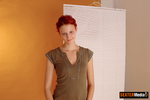 Petite redhead girl slowly taking off he - Picture 9