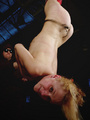 Suspended upside down blonde girl gets - Picture 2