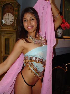 Beautiful Indian Mehla sits ona huge dic - Picture 4