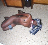 Blindgolded amateur slave beauty in black stockings posing nude.