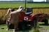 Young old sex. An old guy on a lawnmower fucks a hot bikini babe outdoors.