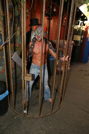 Chained and masked guy gets his hard pec - Picture 1
