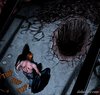 Captor taunts slave by digging her grave. Dumpster Diver By Celestin.