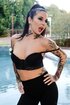 Tattooed horny brunette shows her boobs and love holes