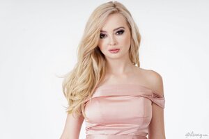 Tiny long-haired blondie shows her beautiful pink dress
