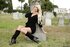 Blonde busty widow in black dress fingering her cunt on the cemetry