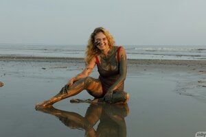 Latvian college girl muddy on the beach