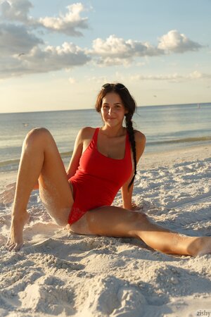 Hot teen poses on the beach