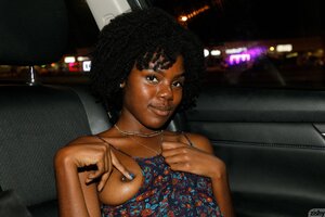 Ebony teen spreads legs in the car