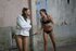 Teen in straitjacket submits to lesbian Dom