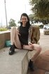 long-haired tattooed brunette shows