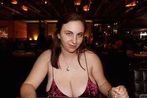 Hot curvy chick enjoys showing her huge boobs in black bra