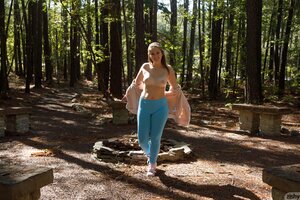 Teen bares her ass in the woods