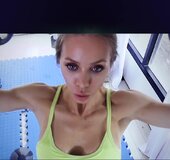 Athletic blonde amateur training hard in the gym