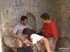 Cute brunette fucked in threesome outdoors
