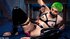 Green-haired harlot in black latex makes herself cum hard