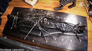 Bondage bed and cock teasing for the latex gimp