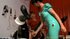 Latex nurses play with the male slave's genitals