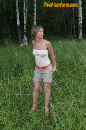 Pissing. Cute teen peeing in the park. - XXX Dessert - Picture 3